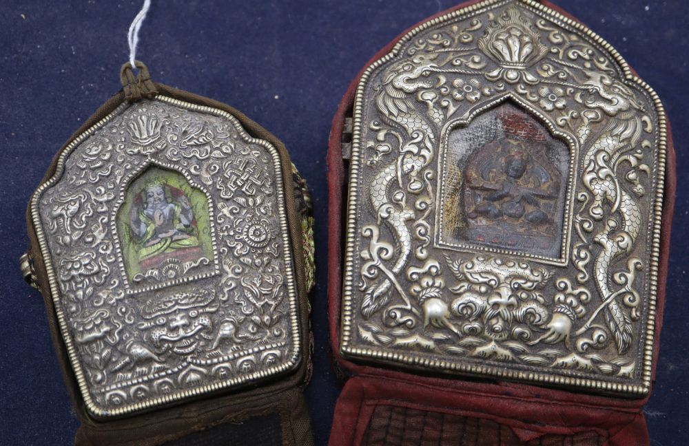 Two Tibetan repousse portable altars, tallest 14.5cm